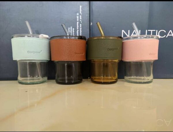 Glass tumblers with leather strap.
