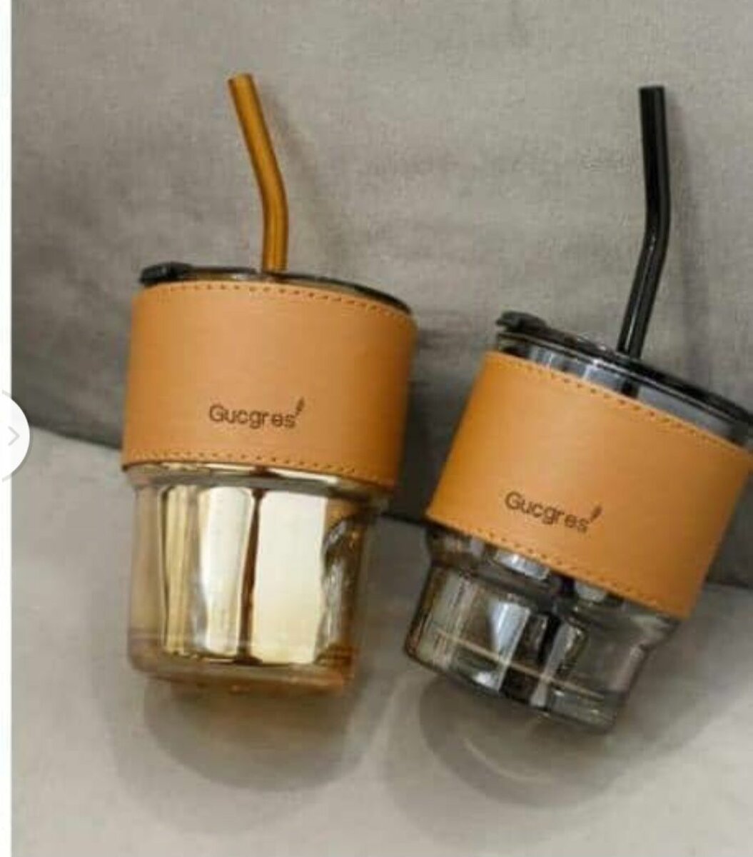 Glass bottle with straw