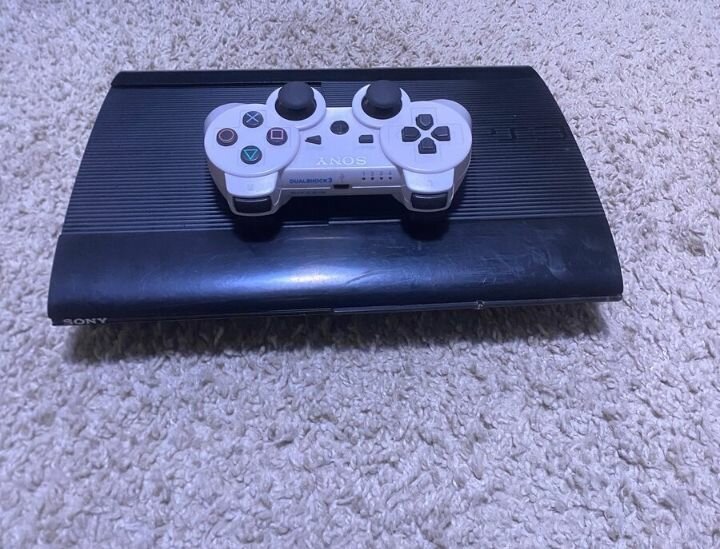 Console Sony PlayStation 3 avec manette DualShock 3