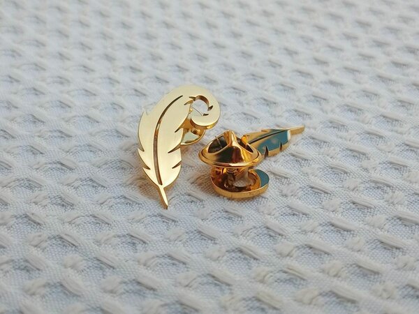 Feather lapel pin