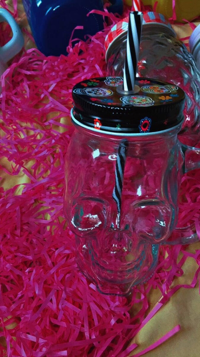 Glass jar with straw
