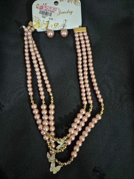 Necklace with small earrings.