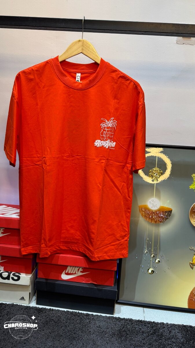 T-shirt orangeimprimé tropical