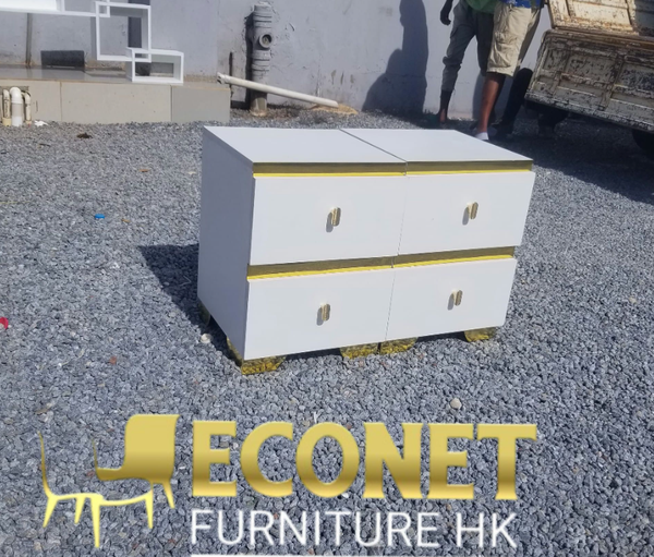 White bedside table with gold-colored inserts