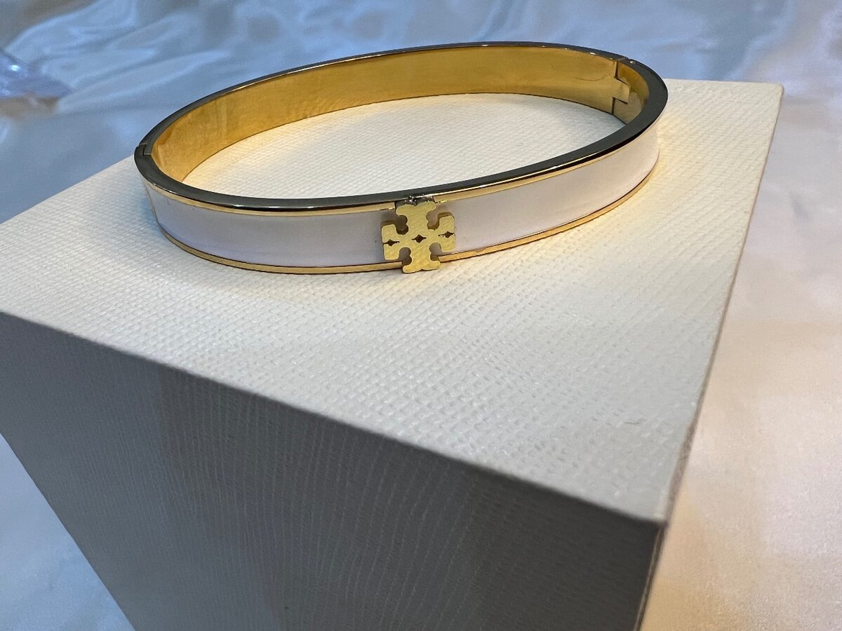 White and gold handcuff for girls.