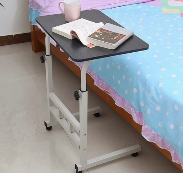 Adjustable table with storage