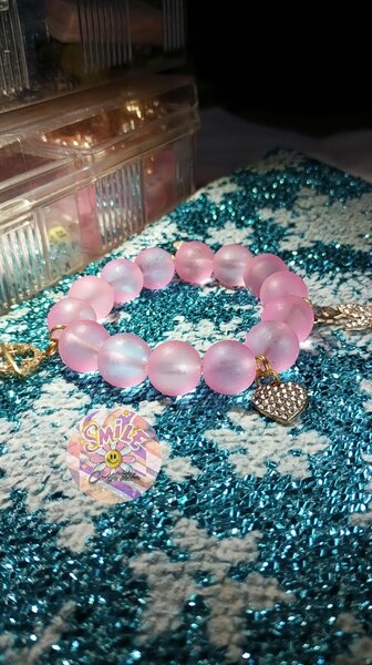 Pink charmed bracelet