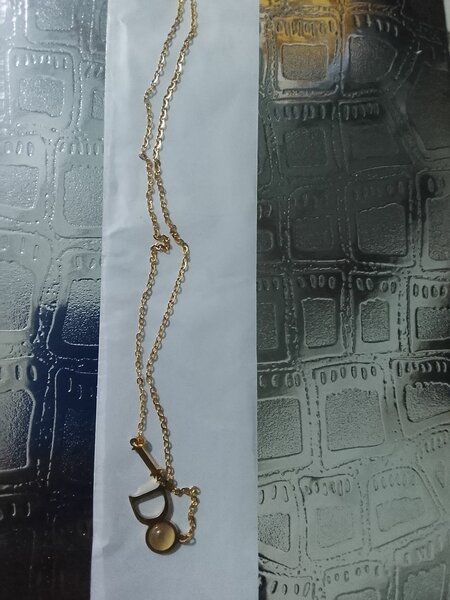 Collier en or avec pendentif clé