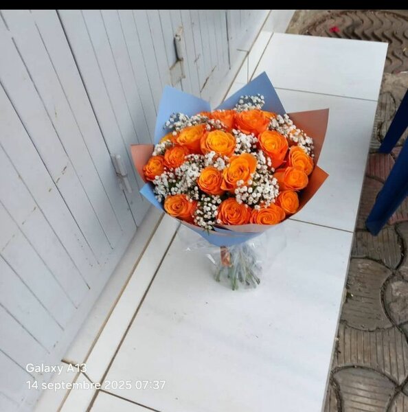 Bouquet de roses oranges et baby's breath