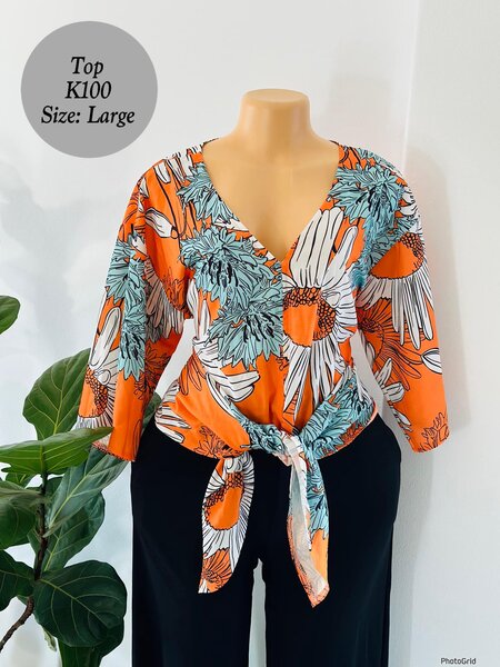 Women's orange top in size L