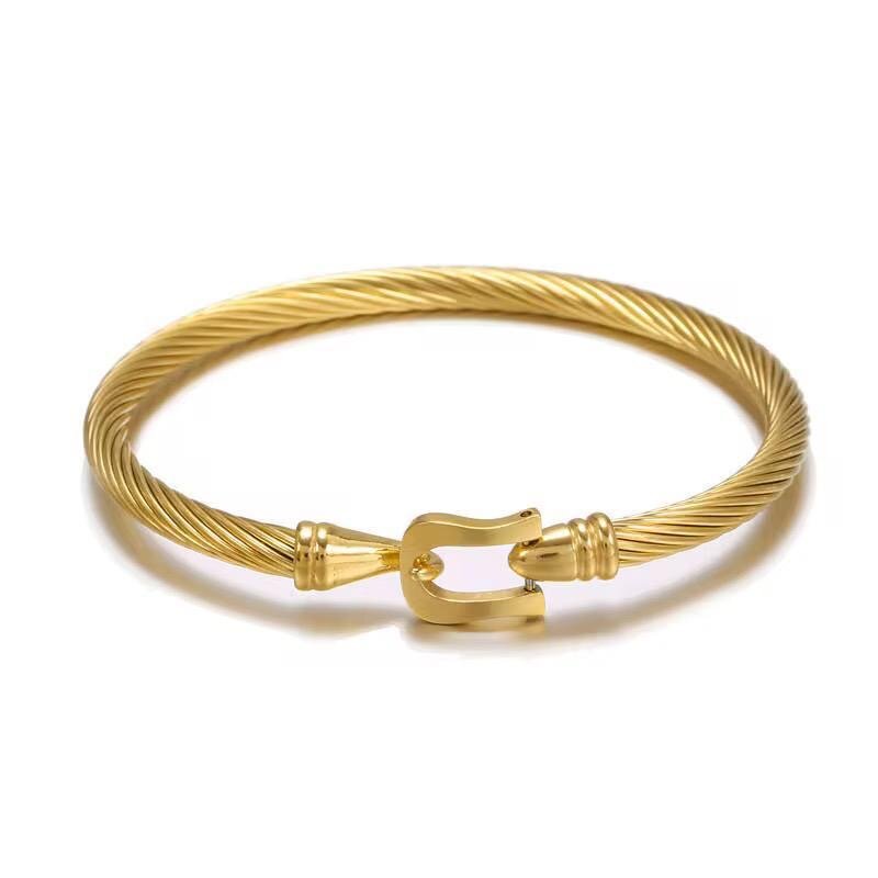 Bracelet jonc torsadé doré