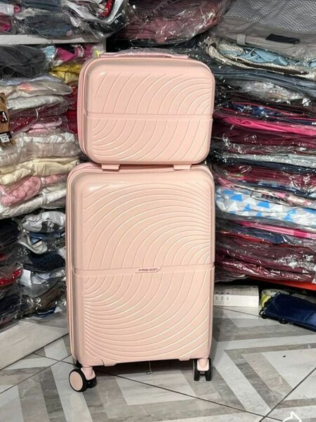 Valise rigide rose pour voyage