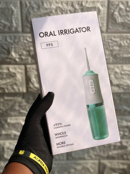 Oral irrigator