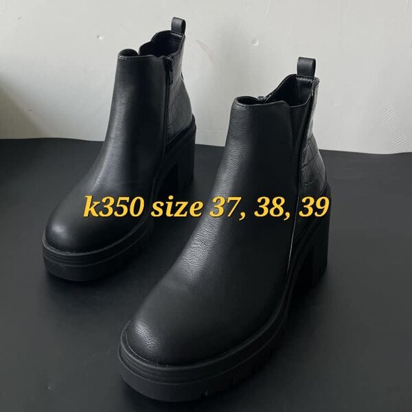 Black patent leather boots with small heels