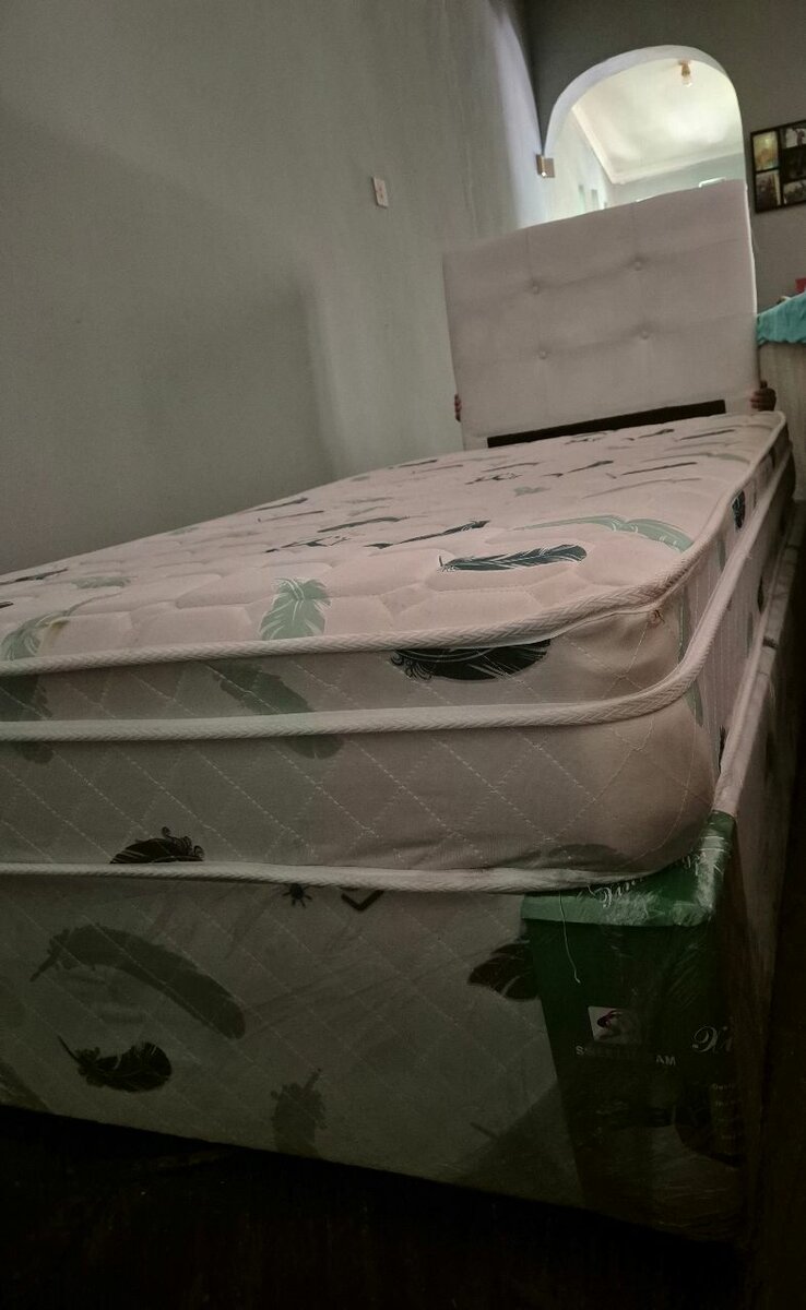 Single bed with headboard