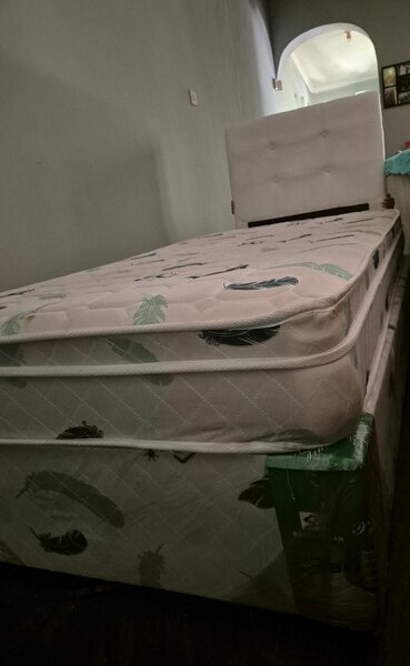 Single bed with headboard