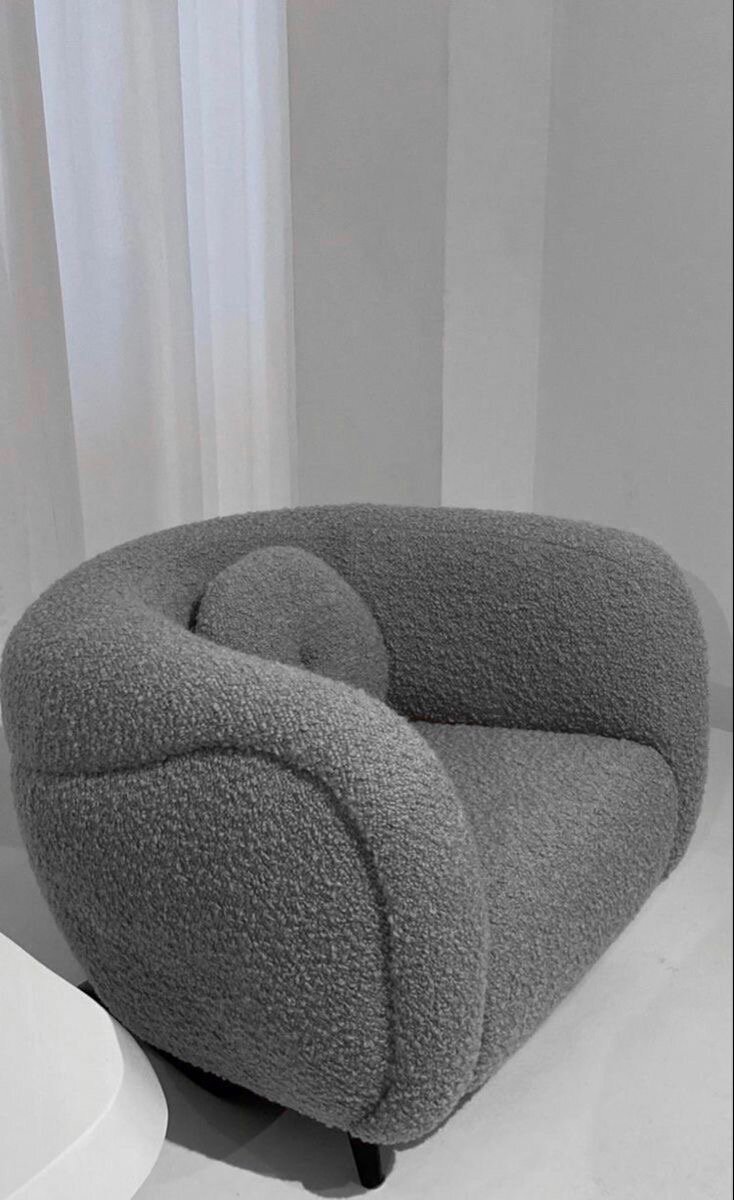 Fauteuil rotatif en tissu bouclé