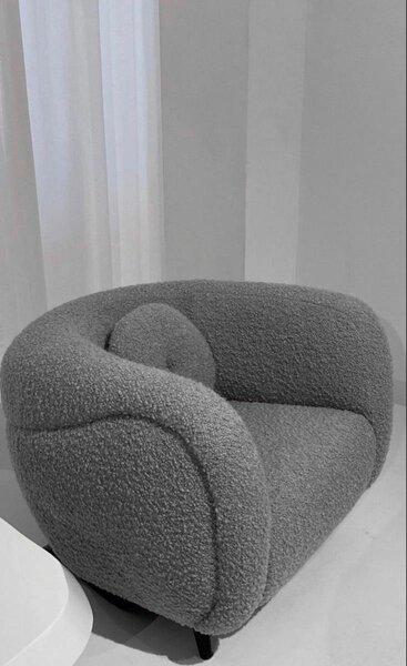 Fauteuil rotatif en tissu bouclé