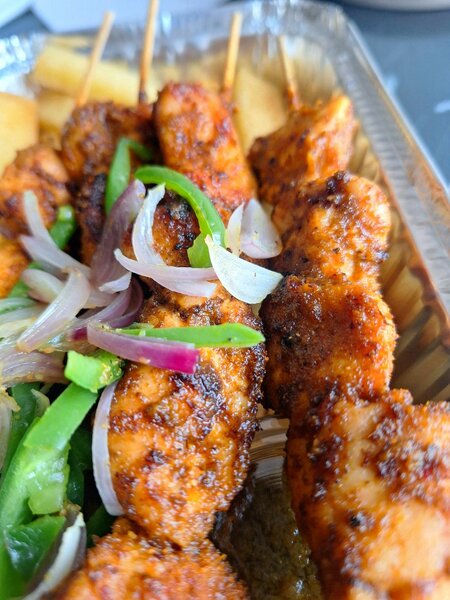Jollof With Grilled Chicken khebabs