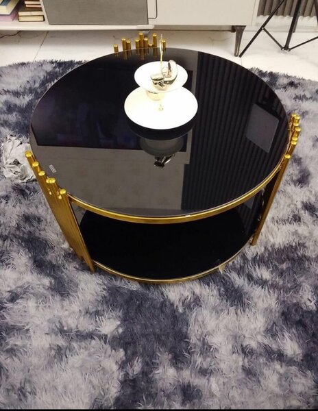 Table basse ronde en verre noir et métal doré