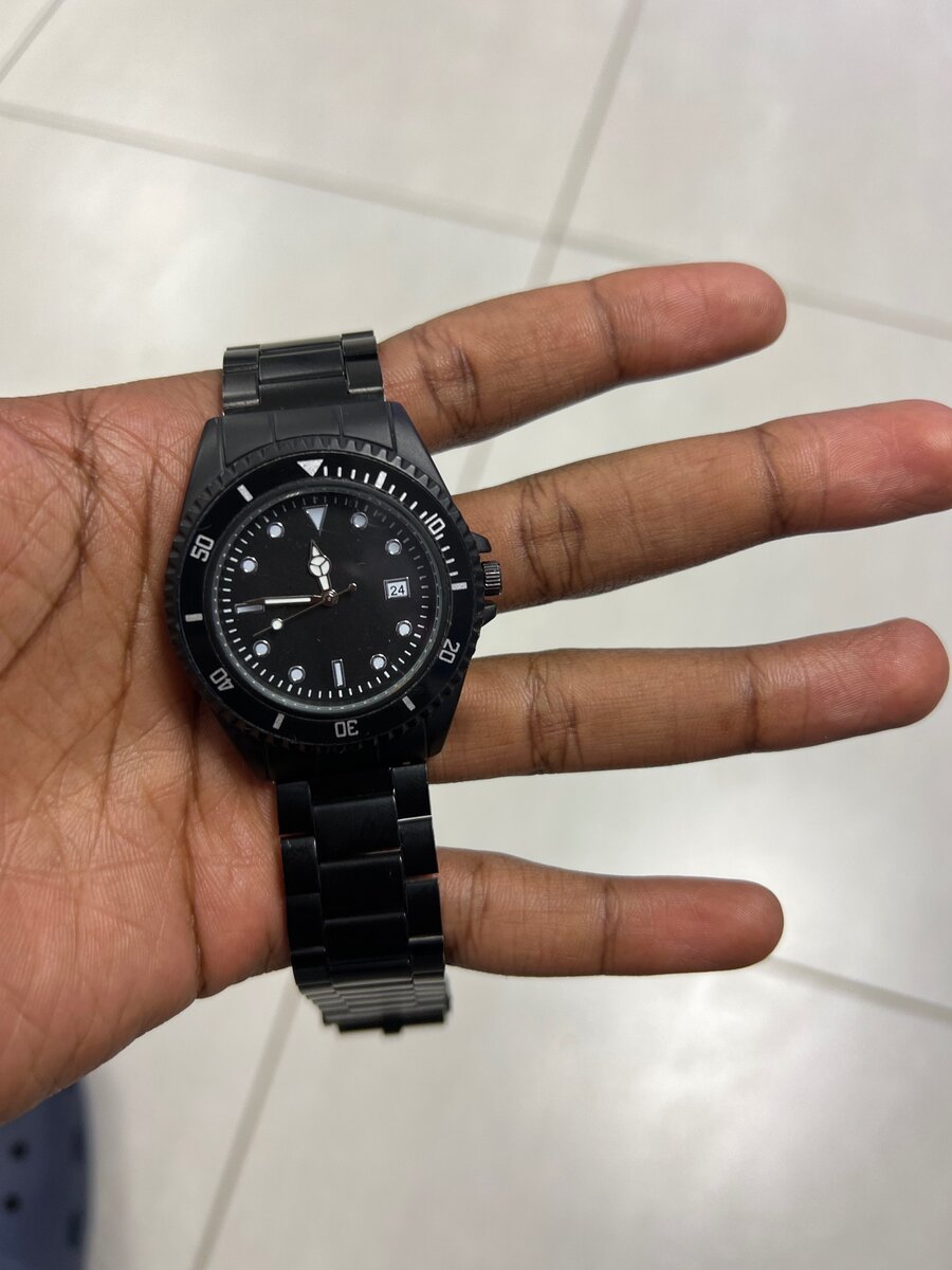 Quartz black on black mens wrist watch.