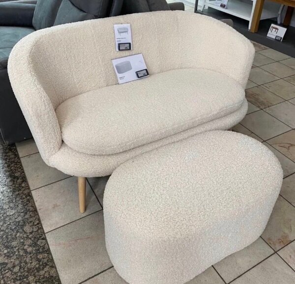 Fauteuil design en tissu bouclé beige