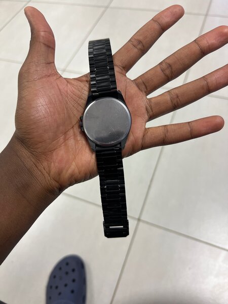 Quartz black on black mens wrist watch.