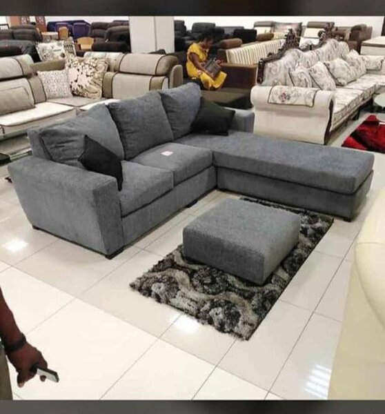 L-couch with throw pillows and footrest