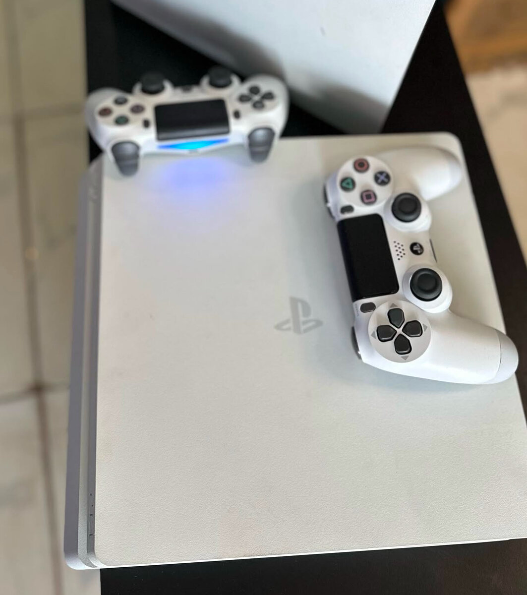 PS4 White Console . 5games installed . One Wireless Gamepad