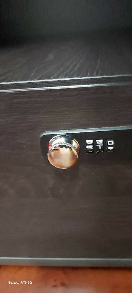 Executive table with a lockable safe using codes.