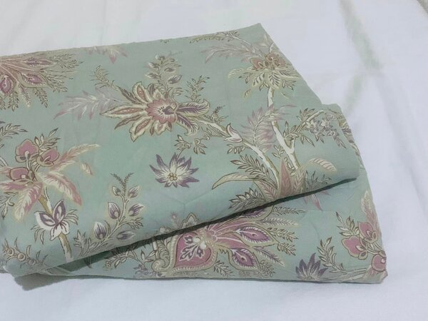 A set of bed linen with floral ornaments (green and pink background)