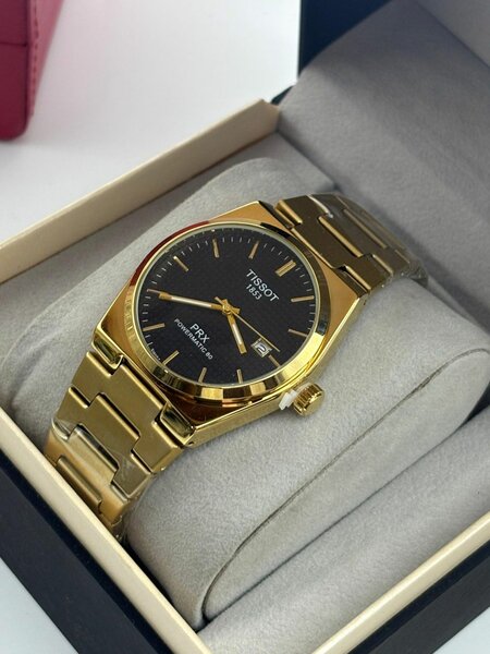 Montre Tissot PRX dorée