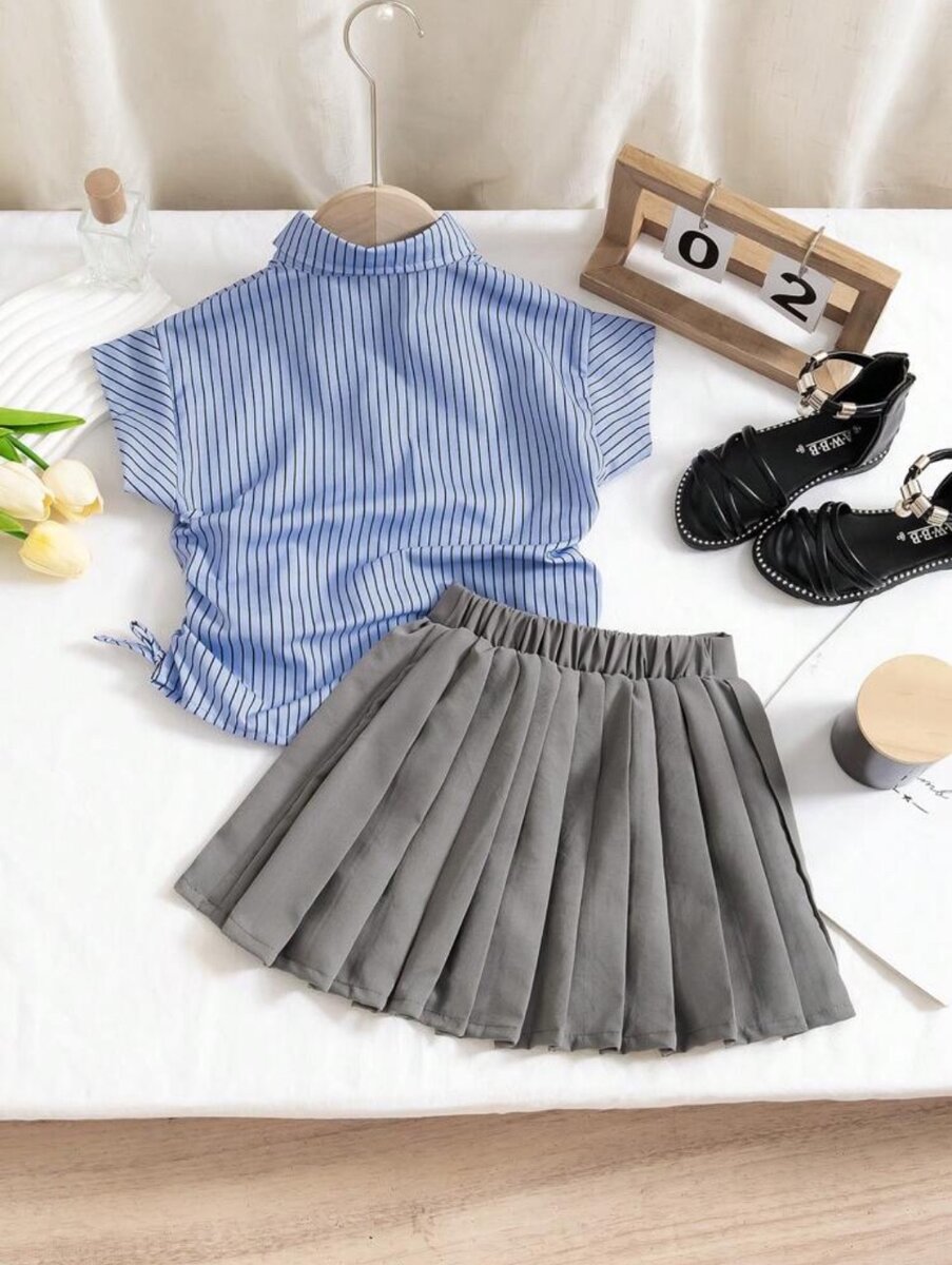 2pcs Girls Shirt With Tie And skirt. 7years