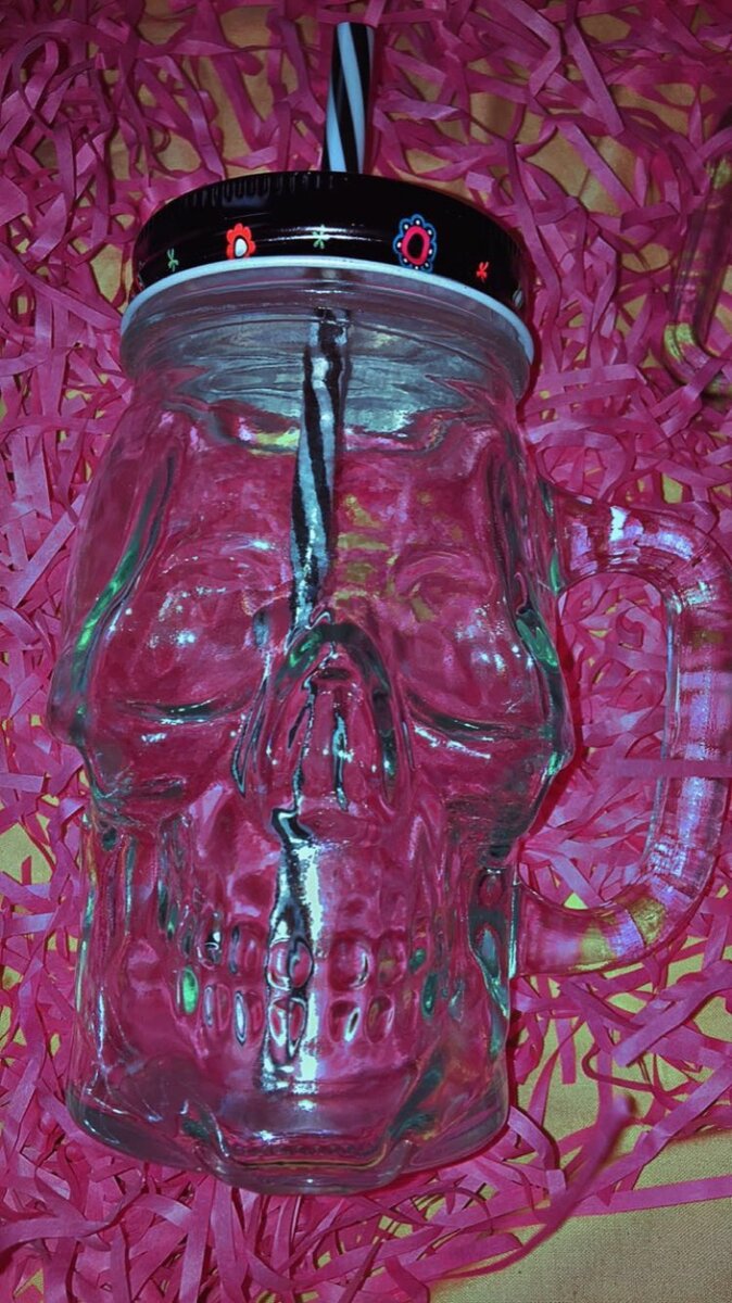 Glass jar with straw