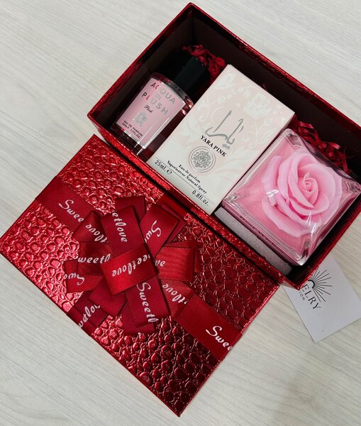 Necklace in rose box, perfume, splash and chocolate