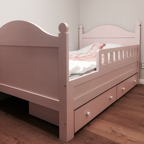 Lit enfant rose avec tiroirs