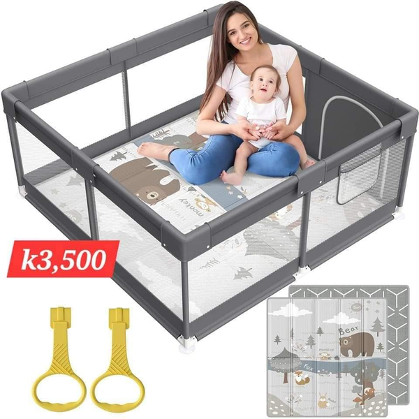 grey playpen with a mat with animals