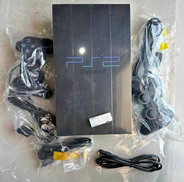 PS2 QUASI NEUF AVEC 20JEUX INSTALLÉ ET 2MANETTES