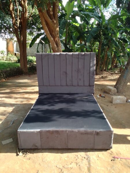 Gray double bed and headboard