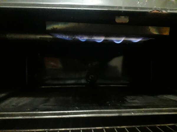 Cooking range with oven