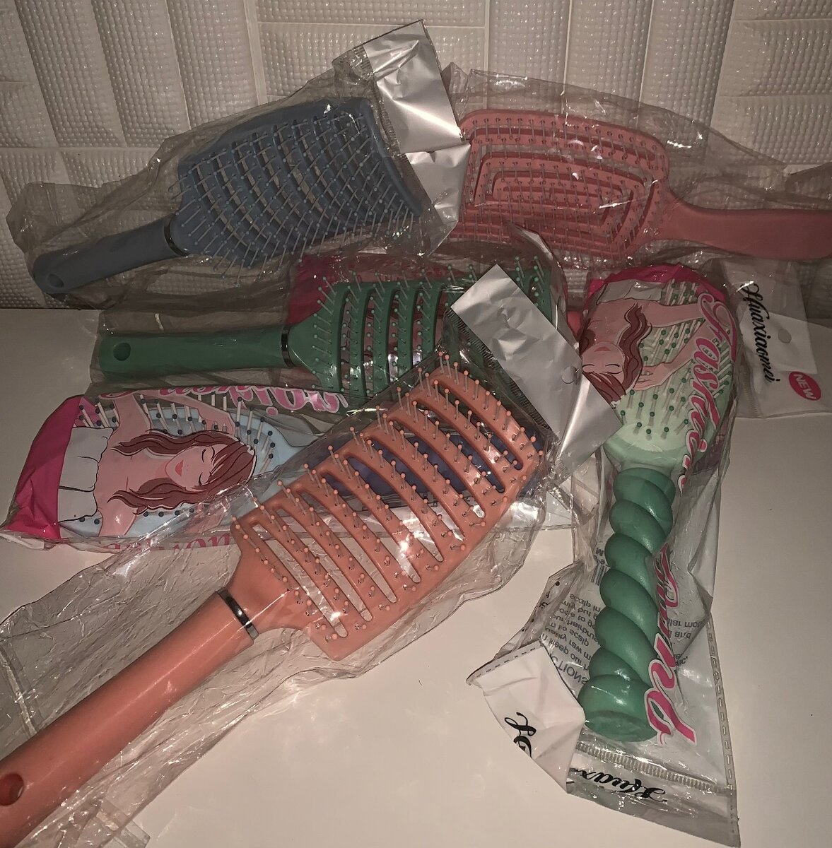 Hotcombs/detangling brushes