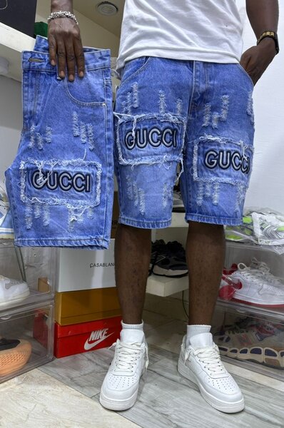 Shorts en jean déchiré Gucci