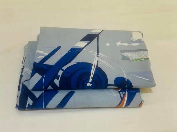 Bed linen with a pattern of an airplane.