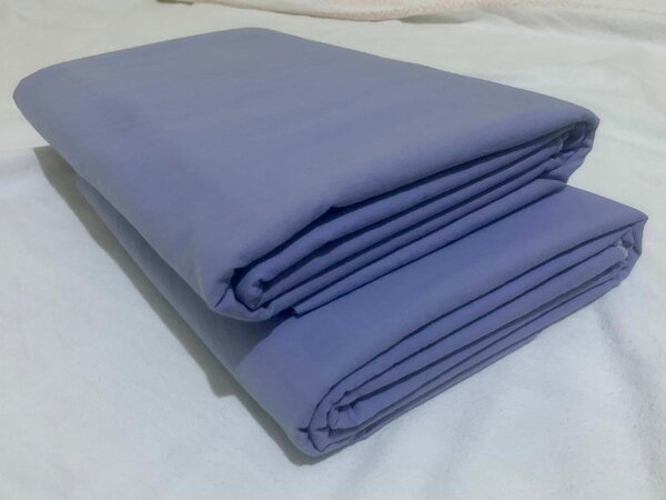 Plain lilac-colored bed linen.