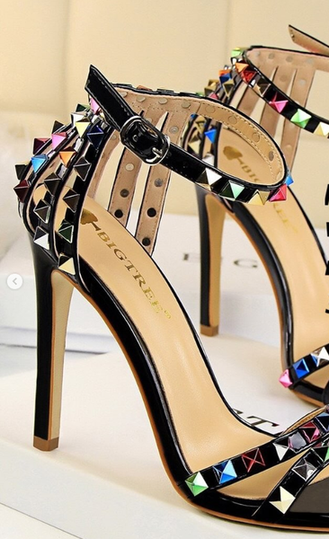 Women's high-heeled black sandals with decorative multicolored spikes