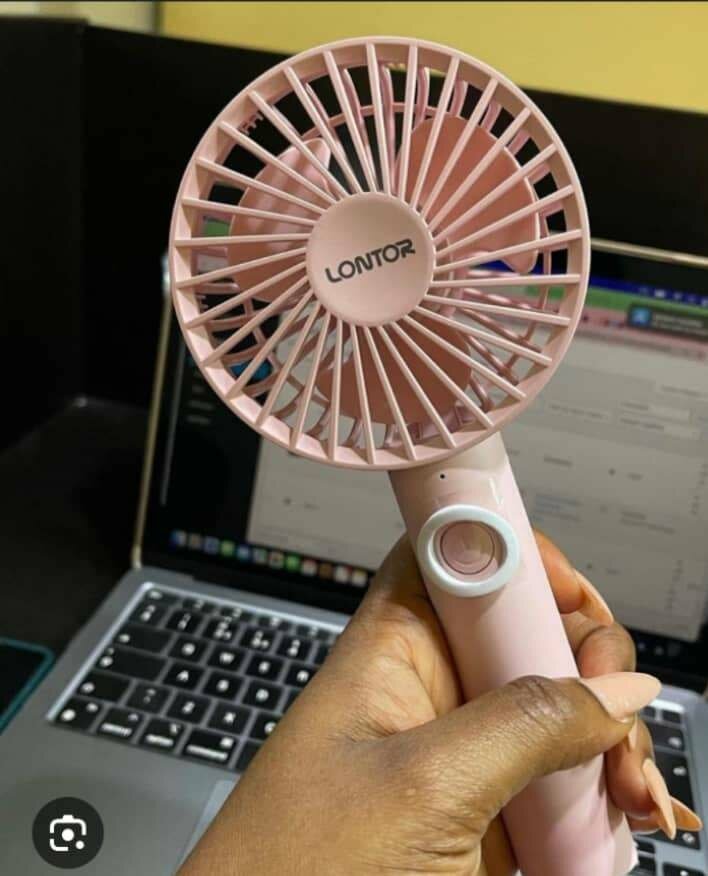 Stay Cool with a Portable hand Fan    Compact design  Powerf