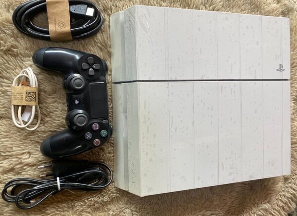 PS4 occasion craqué +10 jeux installés et une manette  -