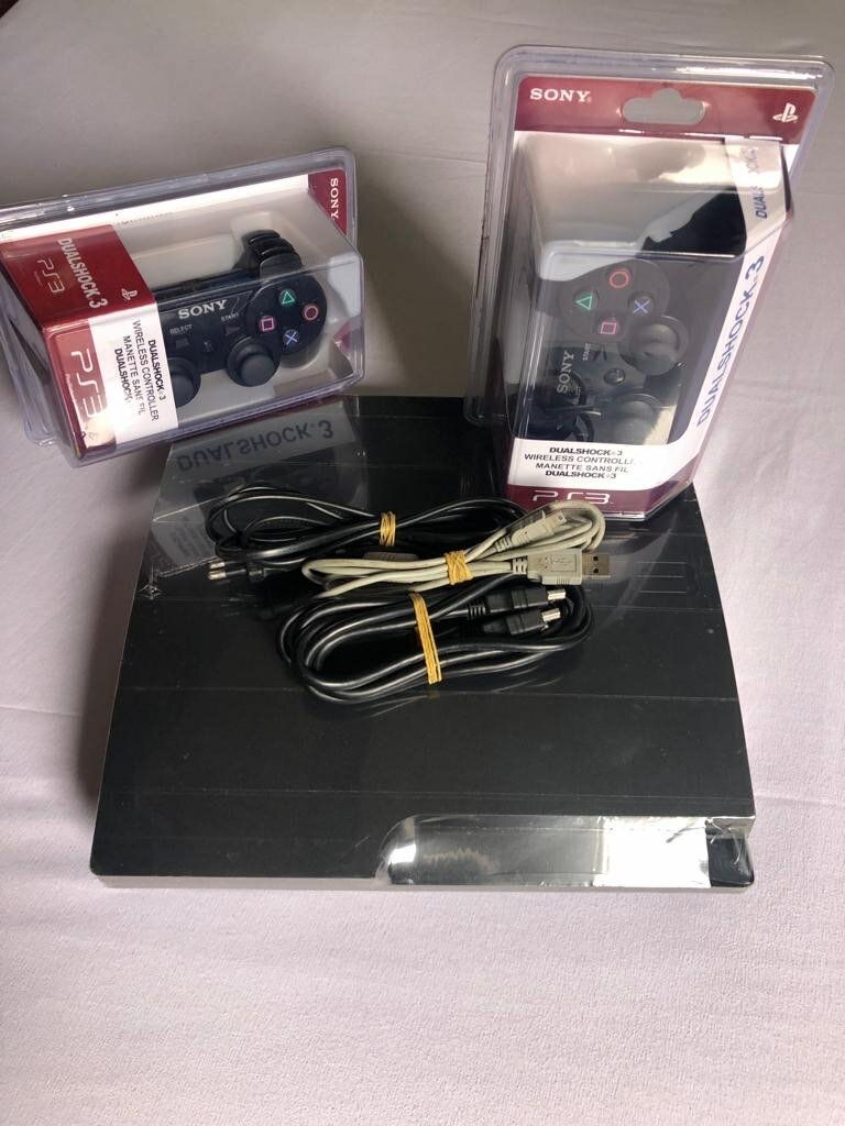 Ps3 Slim + 20 bon jeux intégrés +2  manettes