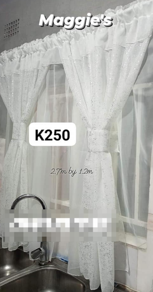 white kitchen curtain with a shiny pattern