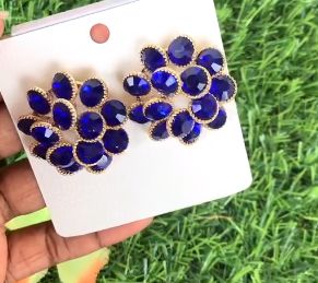 Earrings in the shape of a blue flower